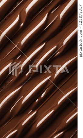 Closeup of melted milk chocolate with wavy glossy texture, smooth surface background for dessert and sweet food design 123875317
