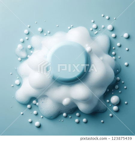 Blue round soap with white foam and bubbles on blue background. Skincare and hygiene concept. Flat lay composition 123875439