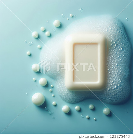 Bar soap with foam and bubbles on blue background. Skincare, hygiene, and cleanliness concept 123875443