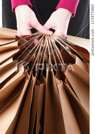 Shopping brown gift bags background 123875860