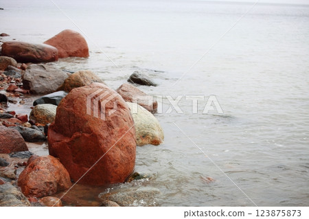 Stones in sea water autumn sea Stones in sea water autumn sea 123875873