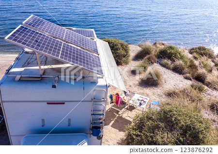 Caravan with tilt solar panels on roof. Aerial view. 123876292