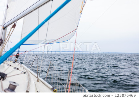 Yacht and oresund bridge between denmark sweden Yacht and oresund bridge between denmark sweden 123876469