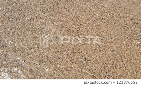 Clear transparent sea or ocean water and waves on sunny day with much stones. Clear transparent sea or ocean water and waves on sunny day with much stones. 123876552