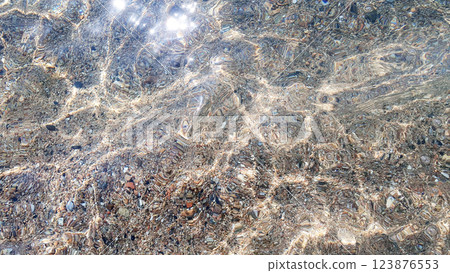 Sea stones. Clear transparent water and waves on sunny day with much stones. Sea stones. Clear transparent water and waves on sunny day with much stones. 123876553