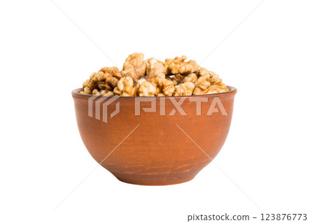 Roasted walnuts in bowl isolated on white background. walnuts is snack or raw of cook. Healthy food concept 123876773