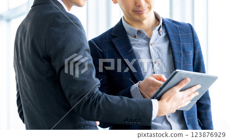 Two male businessmen having a meeting Two male businessmen having a meeting 123876929