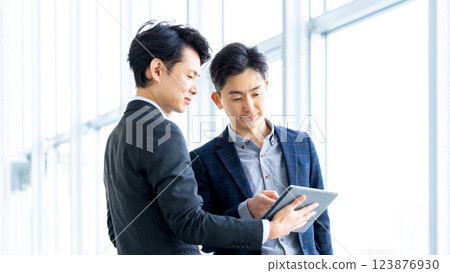 Two male businessmen having a meeting 123876930