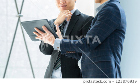 Two male businessmen having a meeting 123876939