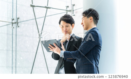 Two male businessmen having a meeting Two male businessmen having a meeting 123876940