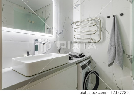 Modern Bathroom with White Marble Walls and Sink Modern Bathroom with White Marble Walls and Sink 123877803