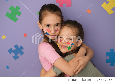 Cuddling cute happy children. Concept for Disability Pride Month, world brain da, mental health and brain neurological health Cuddling cute happy children. Concept for Disability Pride Month, world brain da, mental health and brain neurological health 123877937