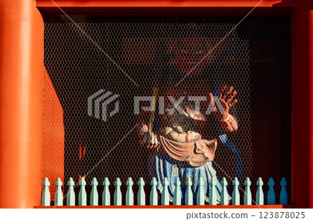 Dramatic play of light and shadow enhances the fierce expression of guardian statue Senso-ji Temple 123878025