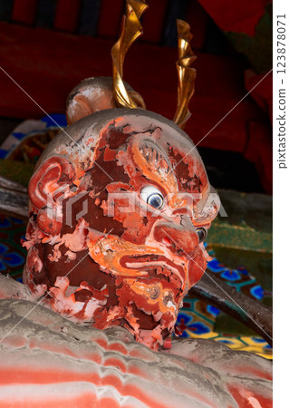 Portrait of a weathered Nio guardian statue at Toshogu Shrine in Nikko Japan 123878071