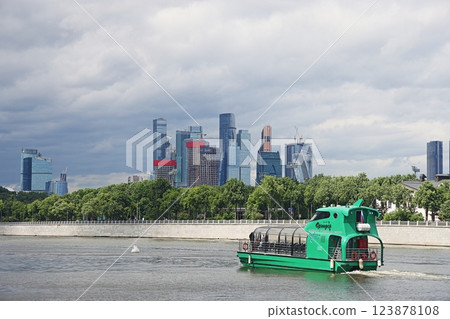 Pleasure boat in front of the buildings of the Moscow City shopping center, June 2022. Pleasure boat in front of the buildings of the Moscow City shopping center, June 2022. 123878108