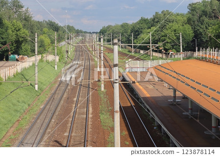 Local railway in the Moscow region, platform and rails, Kraskovo station, June 2022. 123878114