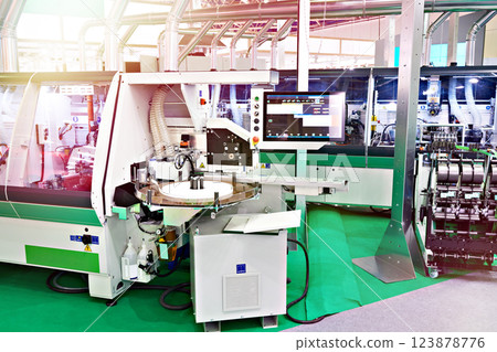 Industrial machines at wood furniture factory 123878776
