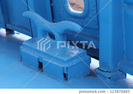 The mooring deck of a cargo ship with anchor winches, an anchor chain on winches, ship mechanisms. The mooring deck of a cargo ship with anchor winches, an anchor chain on winches, ship mechanisms. 123878885