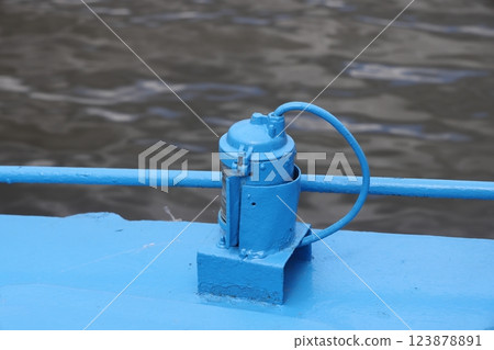 The mooring deck of a cargo ship with anchor winches, an anchor chain on winches, ship mechanisms. 123878891