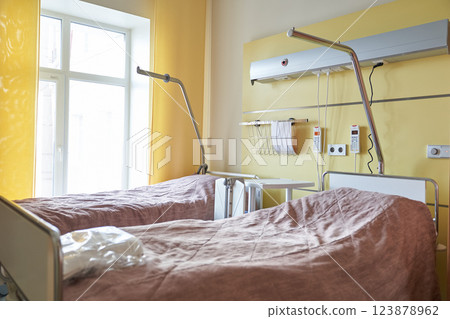 A room with two hospital beds in a modern hospital ward. The concept of a modern medical clinic with the latest equipment. High quality photo 123878962