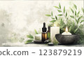Essential oil bottles, soap, stones, and candles surrounded by green leaves on a textured beige background. Spa and wellness concept.  123879219