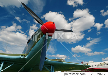 Old retro airplane and clouds 123879617