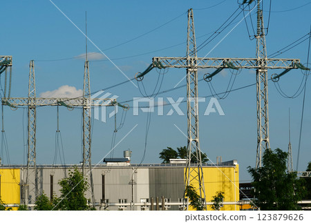 Power transmission towers near electric station 123879626