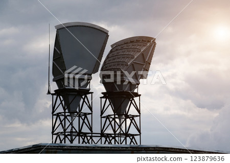 Horn antennas and clouds background 123879636