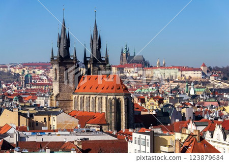 Gothic Church of Our Lady before Tyn with St. Vitus Cathedral and Prague Castle in background, Prague, Czech Republic, sunny day 123879684