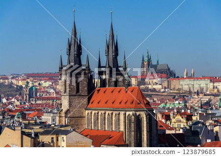 Gothic Church of Our Lady before Tyn with St. Vitus Cathedral and Prague Castle in background, Prague, Czech Republic, sunny day 123879685