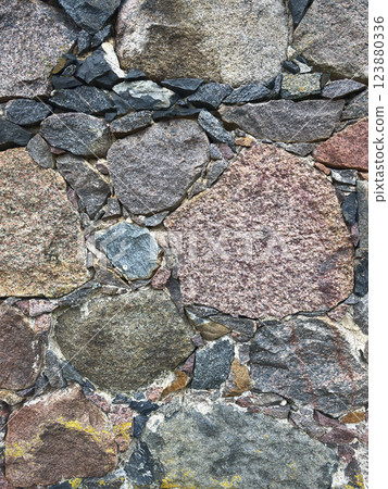 The texture of the split stones. Background with gray, brown, and red stones. Rock structure 123880336