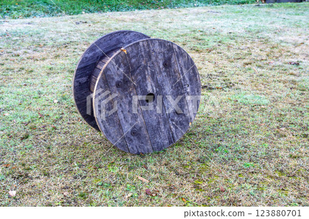 Wooden drum in the park Wooden drum in the park 123880701