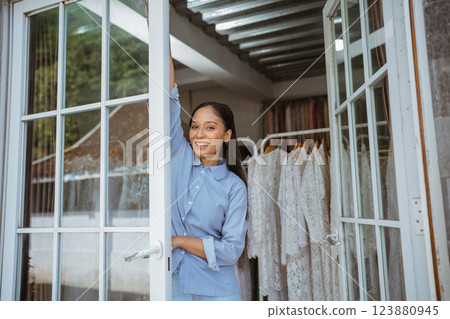 A Stylish Woman Posing Gracefully in an Elegant Fashion Boutique Interior Environment A Stylish Woman Posing Gracefully in an Elegant Fashion Boutique Interior Environment 123880945