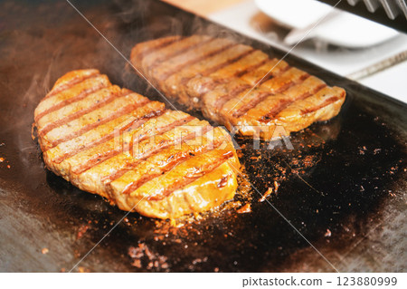 Two pork cutlets steaks grilled on electric grill Two pork cutlets steaks grilled on electric grill 123880999