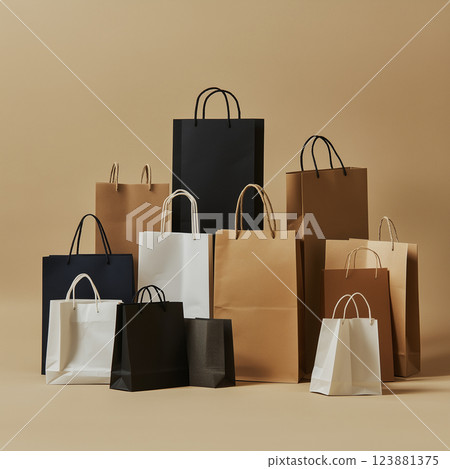 A collection of paper shopping bags in black, white, and brown colors arranged on a beige background. The bags vary in size and have rope handles, suitable for retail, packaging AI generated A collection of paper shopping bags in black, white, and brown colors arranged on a beige background. The bags vary in size and have rope handles, suitable for retail, packaging AI generated 123881375