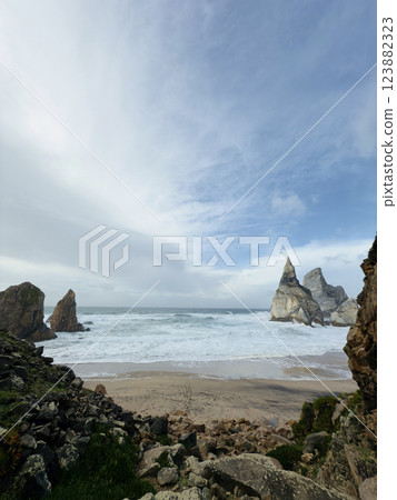 Majestic rocky beach in Atlantic Ocean coastline. Praia da Ursa beach, Sintra, Portugal. Majestic rocky beach in Atlantic Ocean coastline. Praia da Ursa beach, Sintra, Portugal. 123882323