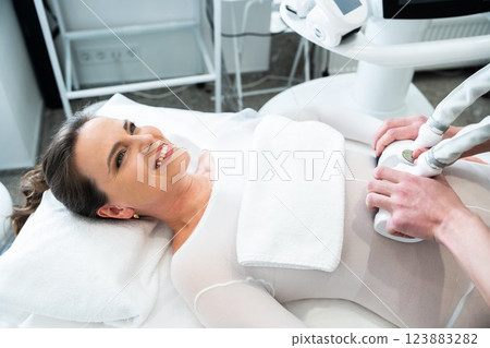 Woman receiving skincare treatment at a modern beauty clinic 123883282