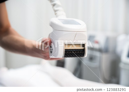 Device for skin treatment being held by a technician in a clinical setting 123883291