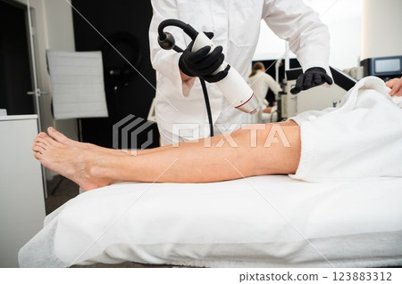 RF lifting in a beauty salon. 123883312