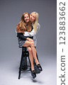 An Elegant Portrait Capturing Two Close Friends in Their Most Stylish and Trendy Outfits 123883662