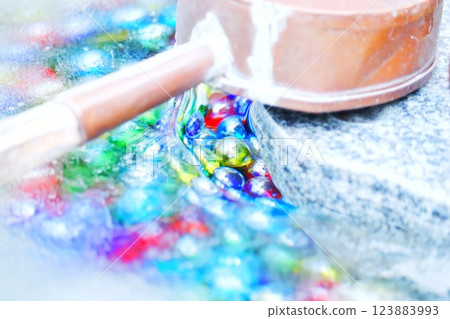 Colorful marbles and frozen water in the chozuya of a shrine Colorful marbles and frozen water in the chozuya of a shrine 123883993