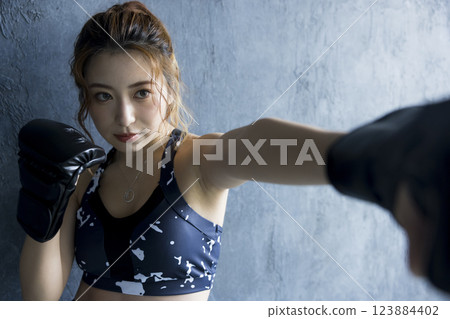 A woman who makes boxing A woman who makes boxing 123884402
