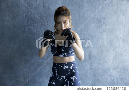 A woman who makes boxing A woman who makes boxing 123884418