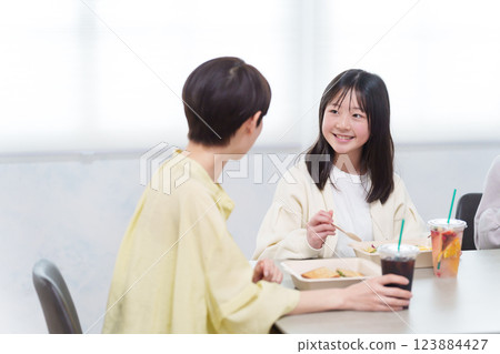 A family eating a delivery lunch at home 123884427