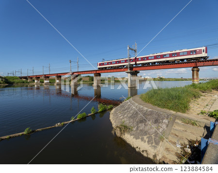 Kintetsu Myoji Line train crossing the Yamato River 123884584