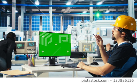 Photovoltaics factory specialist building models of renewable energy generators on green screen PC. Solar panels plant technician building environmentally safe solar cells on mockup computer, camera A 123886136