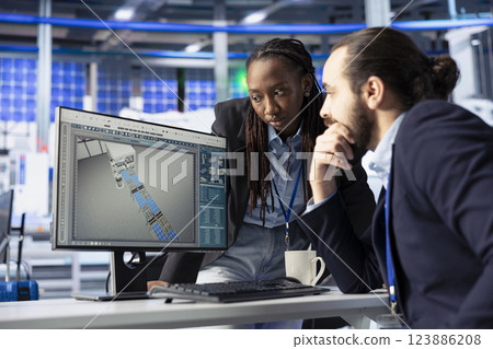 Solar panel facility workers talking, cooperating and reviewing photovoltaic system performance. Coworkers doing brainstorming, analyzing production metrics in industrial plant to optimize efficiency 123886208