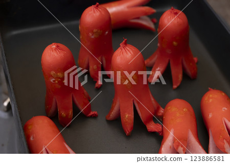 Fry the octopus sausages in a frying pan 123886581