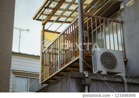 Retro house, second floor, veranda, balcony, air conditioner, outdoor unit 123886800