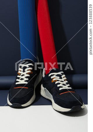 Stylish sneakers with a white sole on a blue background 123888539